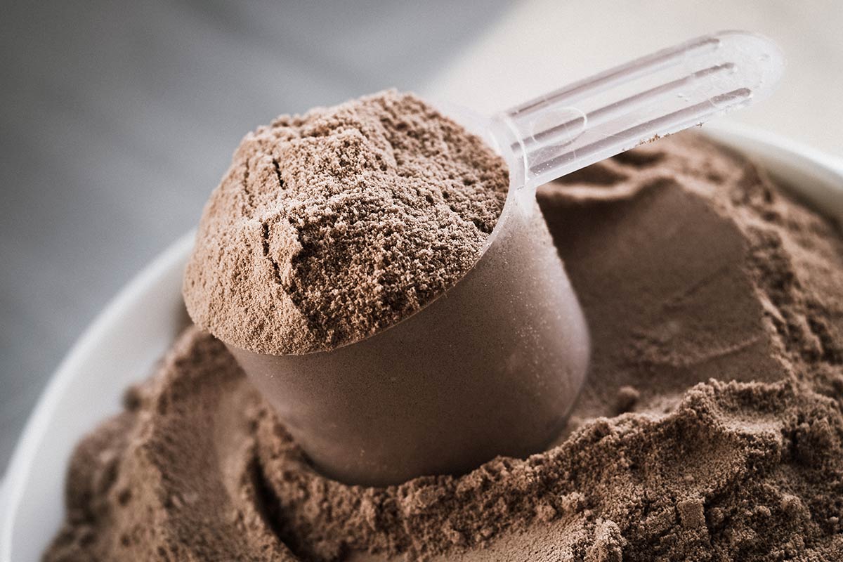 Scoop of chocolate protein powder