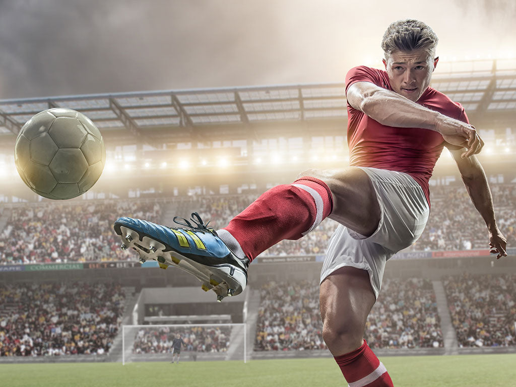 Soccer player kicking ball