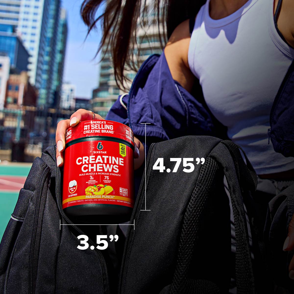 Athlete placing a SIXSTAR Creatine Chews Paradise Punch tub into a gym bag with labeled product dimensions of 4.75 inches tall and 3.5 inches wide, showcasing compact and portable creatine for on-the-go use.